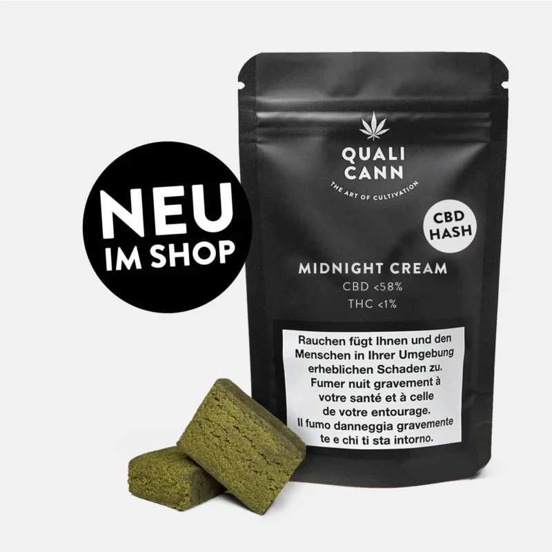 Qualicann CBD Hash Midnight Cream mit Haschstücken vor schwarzer Verpackung